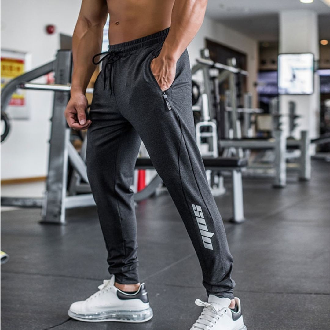 WOLF＞ 抽繩運動長褲  縮口褲