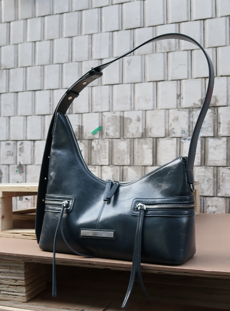 MATIN KIM ASYMMETRICAL ZIPPER BAG IN