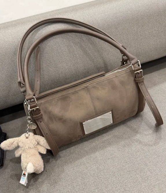 MATIN KIM BUCKLE STRAP SHOULDER BAG IN