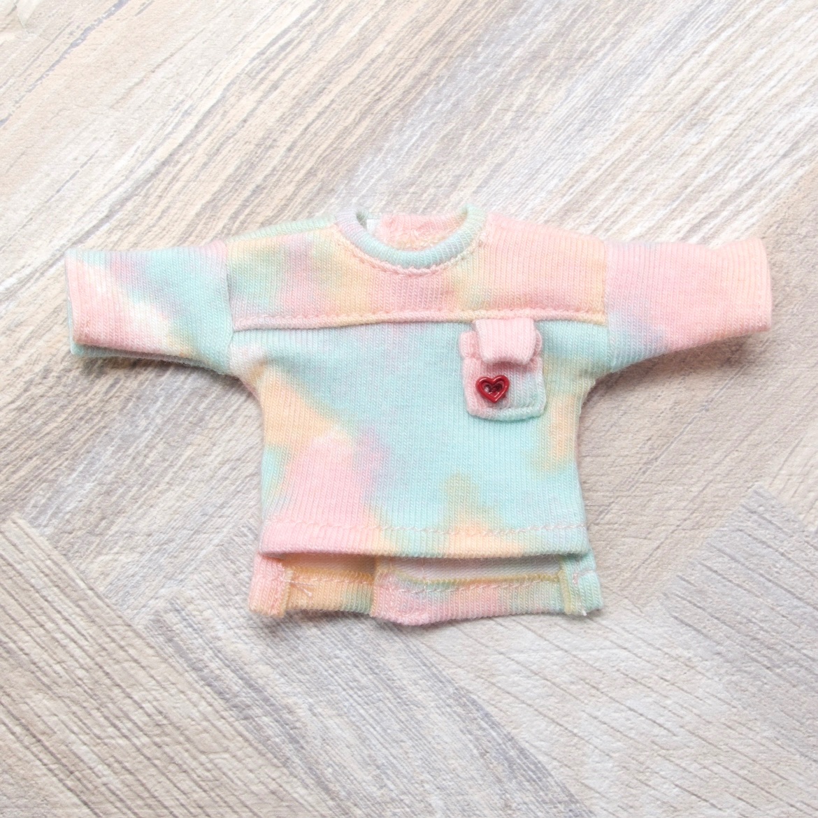 花蒔芸 一字拼接長袖前短後長口袋T 彩色