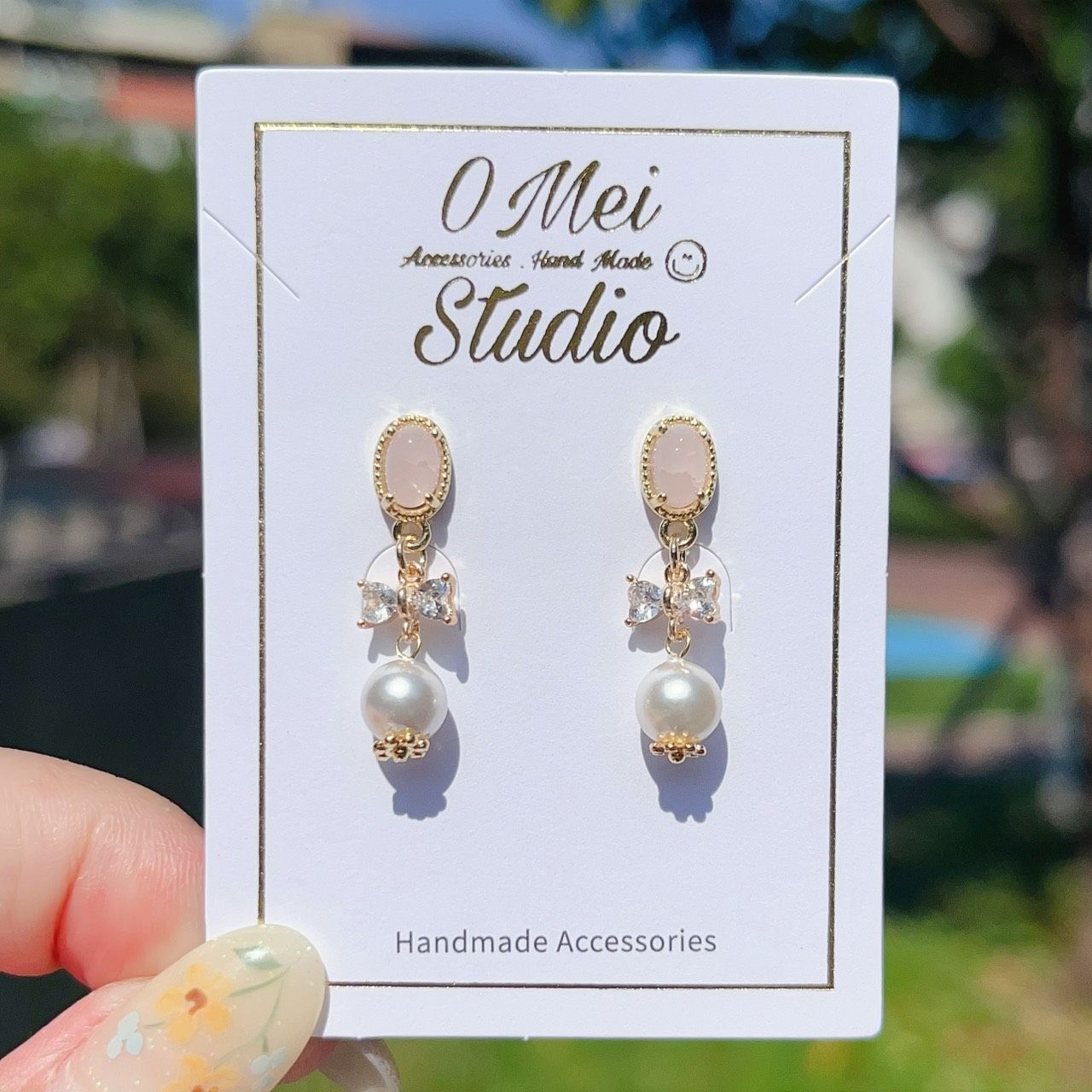 手作耳環-櫻花粉水鑽蝴蝶結貝殼珠耳環