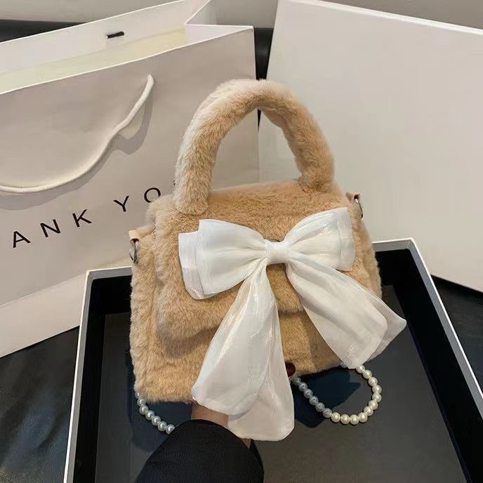 可愛蝴蝶結毛絨時尚手提包2023冬季新款慵懶毛茸茸串珠單肩斜挎包