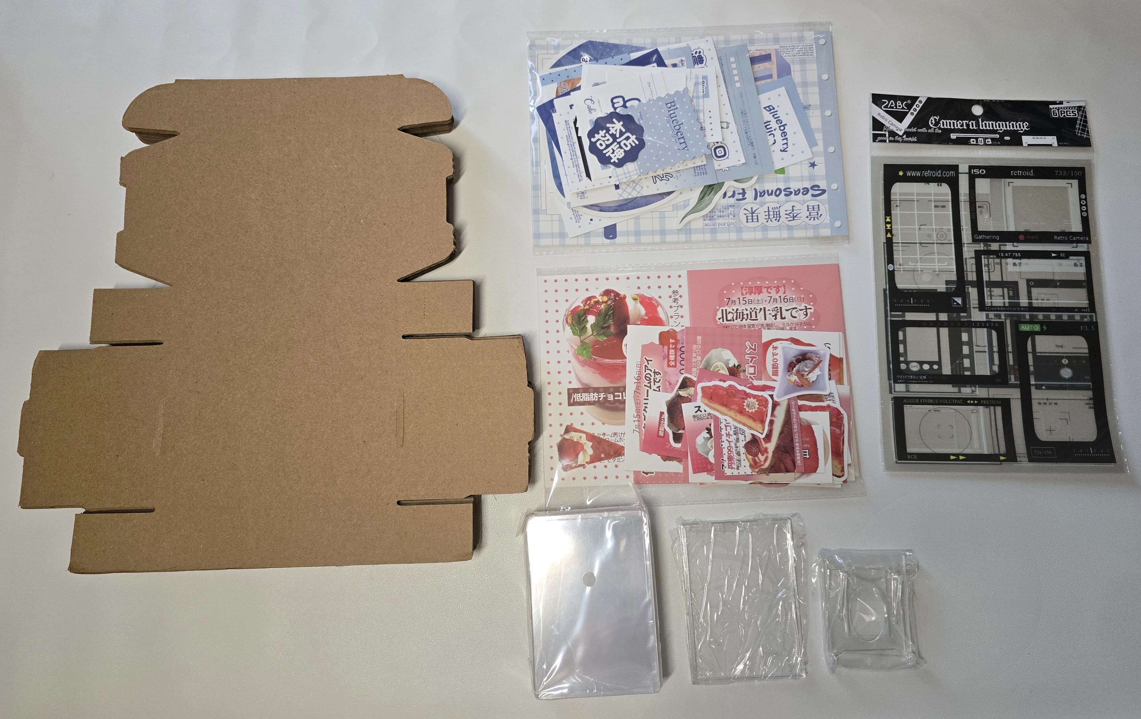 包材組（飛機盒*20 文創試吃set*2 貼紙包*1 無覆膜硬卡套*25 貝殼卡磚*1 卡磚支架*1）
