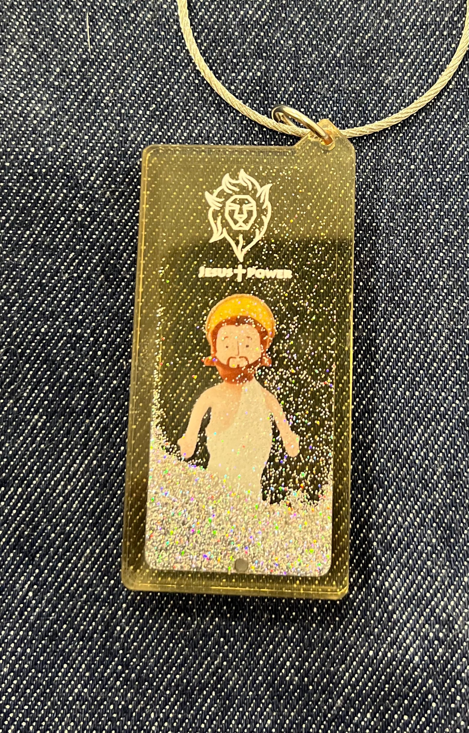 昇天耶穌鑰匙圈與日本設計師共同合研發（3 x7cm）有銀蔥粉在鑰匙圈中滑動
