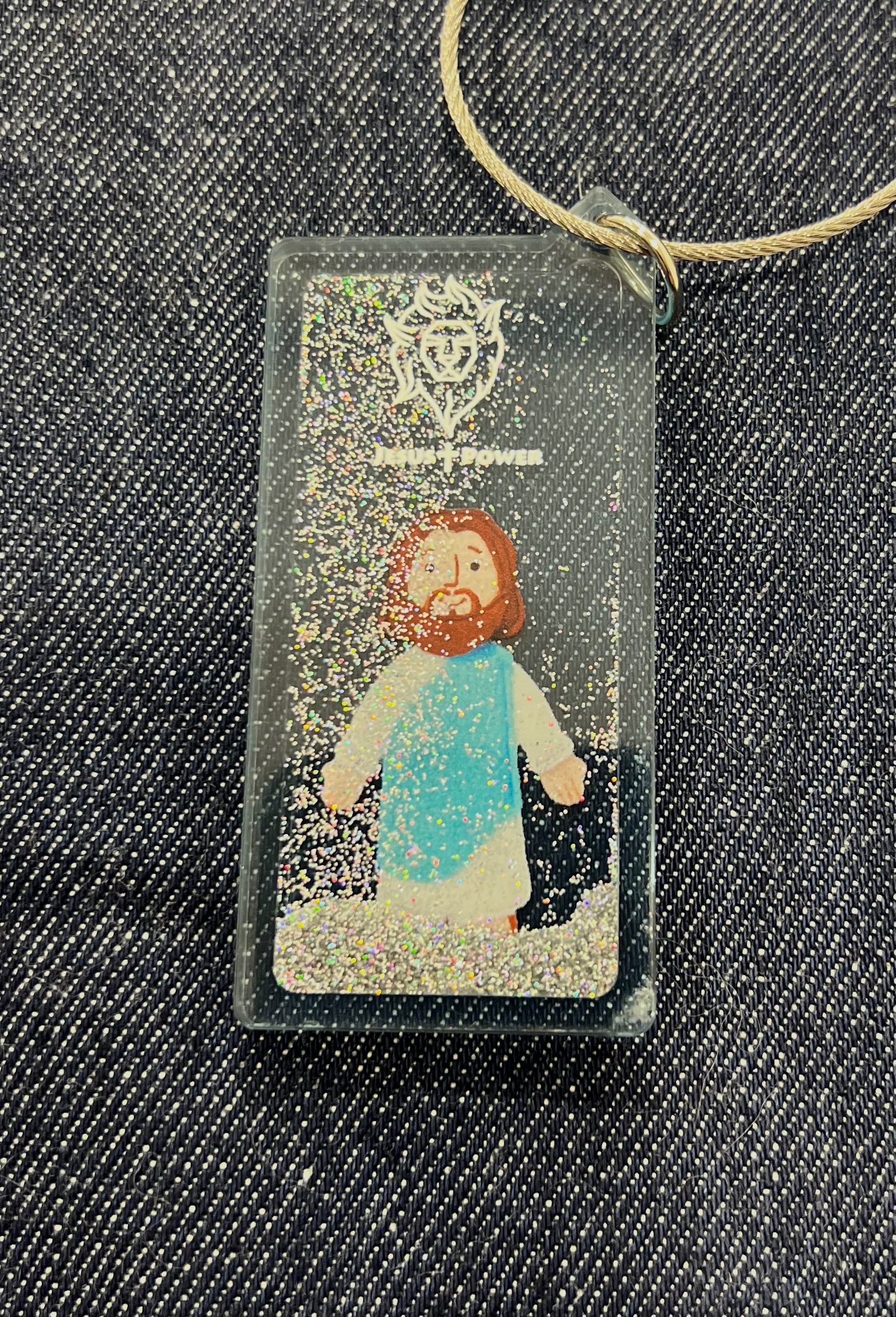 藍色傳道耶穌鑰匙圈與日本設計師共同合研發（3 x7cm）有銀蔥粉在鑰匙圈中滑動