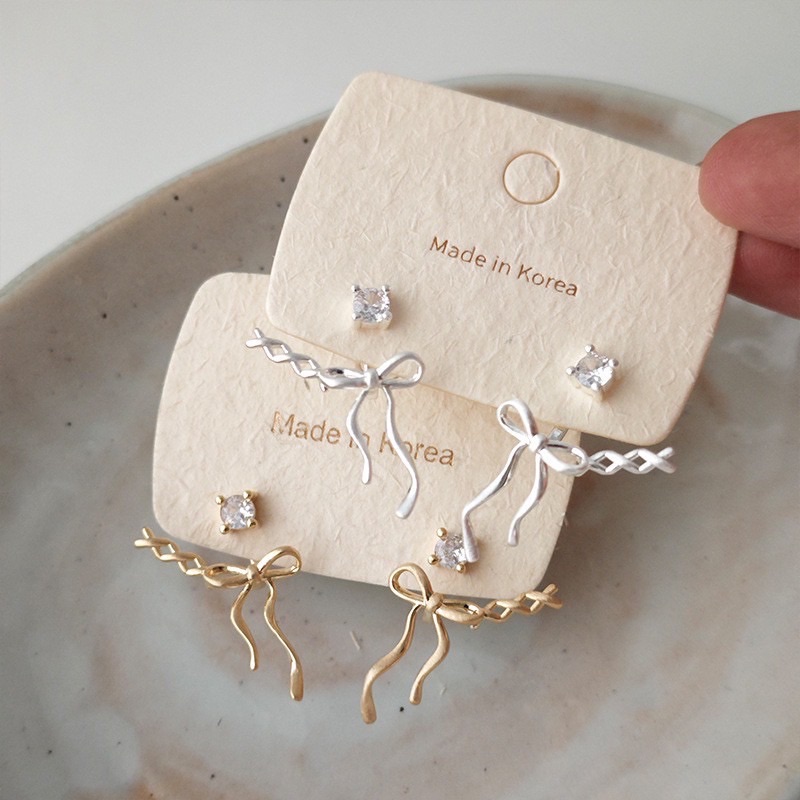 磨砂芭蕾風交叉蝴蝶結兩戴耳環